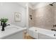 Stylish bathroom featuring hexagon tile surround, soaking tub, and matte black hardware at 1025 Readsboro Dr # 11, Mt Ulla, NC 28125