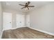 Bedroom with hardwood flooring, ceiling fan, large closet, and plenty of natural light at 1025 Readsboro Dr # 11, Mt Ulla, NC 28125