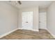 Bedroom with wood floor and ceiling fan. A closet is visible on the left at 1025 Readsboro Dr # 11, Mt Ulla, NC 28125