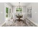Inviting dining area featuring a round table, elegant chairs, a modern chandelier, and access to an outdoor deck at 1025 Readsboro Dr # 11, Mt Ulla, NC 28125