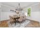 Elegant dining room with a modern chandelier and wainscoting at 1025 Readsboro Dr # 11, Mt Ulla, NC 28125