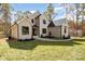 Charming brick home featuring a manicured lawn, dark framed windows, and a paved walkway to the entrance at 1025 Readsboro Dr # 11, Mt Ulla, NC 28125