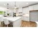 Modern kitchen with white cabinets, quartz countertops, stainless steel appliances, and stylish pendant lighting at 1025 Readsboro Dr # 11, Mt Ulla, NC 28125