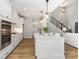 Bright, modern kitchen features white cabinets, stainless steel appliances, and a large center island at 1025 Readsboro Dr # 11, Mt Ulla, NC 28125