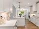 Elegant kitchen with white cabinets, marble countertops, stainless appliances, and a center island at 1025 Readsboro Dr # 11, Mt Ulla, NC 28125
