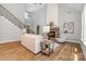 Stylish living room with modern decor, a cozy fireplace, and natural light streaming in through large windows at 1025 Readsboro Dr # 11, Mt Ulla, NC 28125