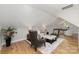 Cozy living area featuring hardwood floors, comfortable seating, and a view of a dedicated office space at 1025 Readsboro Dr # 11, Mt Ulla, NC 28125
