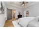 Main bedroom features a trey ceiling, ceiling fan, and ensuite bathroom with barn door at 1025 Readsboro Dr # 11, Mt Ulla, NC 28125