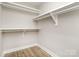 Walk-in closet with simple shelving and wooden floor at 1025 Readsboro Dr # 11, Mt Ulla, NC 28125