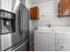 Laundry room includes a stainless steel refrigerator and washer/dryer set at 1812 Shearers Rd, Davidson, NC 28036