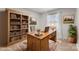 Home office features built-in shelving and wood desk at 1812 Shearers Rd, Davidson, NC 28036