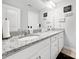 Bathroom with double vanity, granite countertop, white cabinets and large mirror at 2657 Cheverny Pl, Concord, NC 28027
