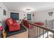 A bonus room featuring recliners, gym equipment, carpet and a small stage at 2657 Cheverny Pl, Concord, NC 28027
