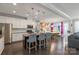A spacious open kitchen with an island, stainless steel appliances, and hardwood floors at 2657 Cheverny Pl, Concord, NC 28027