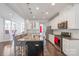 Modern kitchen with a large island, stainless steel appliances, and sleek countertops at 2657 Cheverny Pl, Concord, NC 28027