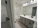 Stylish bathroom with double sink vanity, modern fixtures, and a walk-in shower and toilet at 3014 Cunningham Farm Dr, Indian Trail, NC 28079