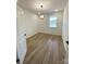 Bright bedroom with hardwood floors and a modern light fixture at 3014 Cunningham Farm Dr, Indian Trail, NC 28079