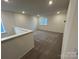 Spacious bonus room with neutral carpet, recessed lighting, and natural light from windows at 3014 Cunningham Farm Dr, Indian Trail, NC 28079