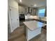Modern kitchen with stainless steel appliances, center island and shaker style cabinets at 3014 Cunningham Farm Dr, Indian Trail, NC 28079