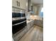 Close up of a kitchen with stainless appliances, countertops, and light shaker style cabinets at 3014 Cunningham Farm Dr, Indian Trail, NC 28079