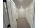 Spacious walk-in closet with built-in shelving, neutral carpet, and ample storage space at 3014 Cunningham Farm Dr, Indian Trail, NC 28079