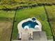 Aerial view of the pool with patio, umbrellas, hot tub and large backyard at 7248 Waterwheel Sw St, Concord, NC 28025