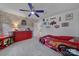 Fun themed bedroom with a car bed, Route 66 decor, and vibrant red accents at 7248 Waterwheel Sw St, Concord, NC 28025