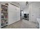 Stylish room with a Murphy bed, built-in shelving, and a functional workspace at 7248 Waterwheel Sw St, Concord, NC 28025