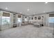 Spacious bonus room with neutral carpet, and many windows at 7248 Waterwheel Sw St, Concord, NC 28025
