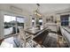 Charming dining area with a wooden table and bench seating, brightened by natural light at 7248 Waterwheel Sw St, Concord, NC 28025