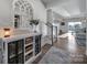 Inviting foyer with stylish decor, leading to a bright and open living space with hardwood floors at 7248 Waterwheel Sw St, Concord, NC 28025