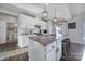 Kitchen with granite counters, center island, pendant lights, and stainless steel appliances at 7248 Waterwheel Sw St, Concord, NC 28025