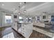 Kitchen with granite counters, center island, stainless appliances, and open to the living area at 7248 Waterwheel Sw St, Concord, NC 28025