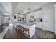 Kitchen with granite counters, center island, pendant lights, stainless appliances, and pantry at 7248 Waterwheel Sw St, Concord, NC 28025