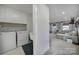 Convenient laundry area with modern appliances and leads into a comfortable living area at 7248 Waterwheel Sw St, Concord, NC 28025