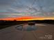 Backyard pool with patio and beautiful sunset view at 7248 Waterwheel Sw St, Concord, NC 28025