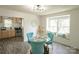 Bright dining area with a glass table, stylish chairs, and window seating located adjacent to the kitchen at 106 S Inman Ave, Bessemer City, NC 28016