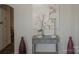 Hallway console table with decorative painting and decor pieces that provides a visual point of interest at 106 S Inman Ave, Bessemer City, NC 28016