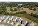 Overhead view of a residential neighborhood with well-manicured lawns and tree-lined streets at 1109 Freeman View Dr, Albemarle, NC 28001
