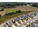 Scenic aerial view of suburban homes bordering a green space with trees in the background at 1109 Freeman View Dr, Albemarle, NC 28001