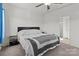 Bright bedroom featuring a queen-size bed, ceiling fan, and neutral decor at 1109 Freeman View Dr, Albemarle, NC 28001
