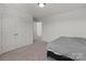 Simple bedroom featuring carpet flooring, closet, and minimal furnishing at 1109 Freeman View Dr, Albemarle, NC 28001