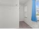 Bright closet space with carpet flooring, natural light, and shelving at 1109 Freeman View Dr, Albemarle, NC 28001