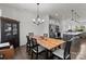 A spacious dining room area with modern black furniture and an open layout at 1109 Freeman View Dr, Albemarle, NC 28001