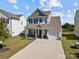 Inviting two-story home with a well-maintained lawn, front porch and integrated one car garage at 1109 Freeman View Dr, Albemarle, NC 28001