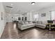 Open concept living area flowing into a kitchen with modern furnishings and hardwood floors at 1109 Freeman View Dr, Albemarle, NC 28001