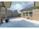 Brick home's backyard with patio and meticulous landscaping for a serene outdoor setting at 2014 Newstyle Way, Tega Cay, SC 29708