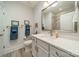 Modern bathroom with white cabinetry, granite countertops, and a framed mirror, creating a clean and elegant design at 2014 Newstyle Way, Tega Cay, SC 29708