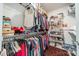 Walk-in closet featuring shelving and hanging rods for organized storage, offering ample space for clothing and accessories at 2014 Newstyle Way, Tega Cay, SC 29708