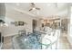 Spacious living room with an open floor plan, stylish seating, and a view of the modern kitchen and bar area at 2014 Newstyle Way, Tega Cay, SC 29708